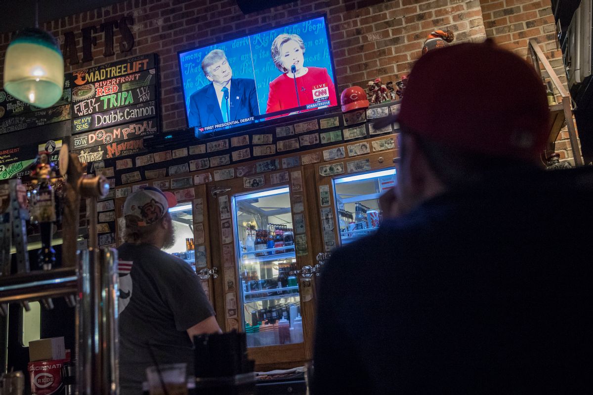 Patrons watch the presidential debate between Democratic presidential nominee Hillary Clinton and Republican presidential nominee Donald Trump. (AP)