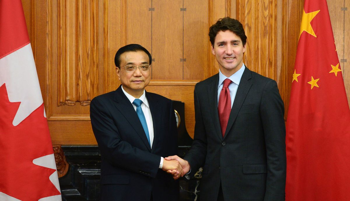 Canadian Prime Minister Justin Trudeau greets Chinese Premier Li Keqiang, left, as holds an expanded meeting in the Cabinet room on Parliament Hill in Ottawa on Thursday, Sept. 22, 2016. (Sean Kilpatrick/The Canadian Press via AP) (AP)