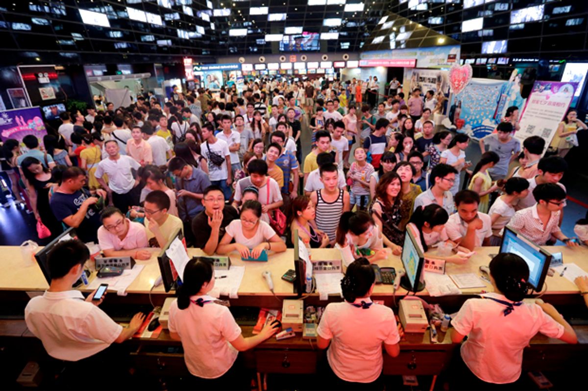 People wait for tickets at a movie theatre in Wuhan, Hubei province, China, August 13, 2013.   (Reuters/Darley Shen)