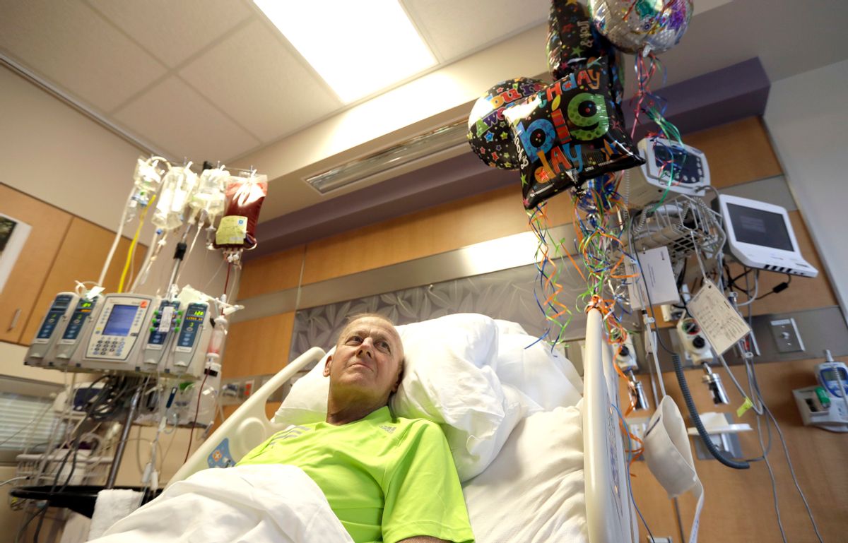 Sportscaster Craig Sager lies in his bed while receiving a transplant Wednesday, Aug. 31, 2016, at MD Anderson Cancer Center in Houston. After a battle with acute myeloid leukemia, Sager passed away in 2016 shortly after his third bone marrow transplant. (AP Photo/David J. Phillip) (AP)