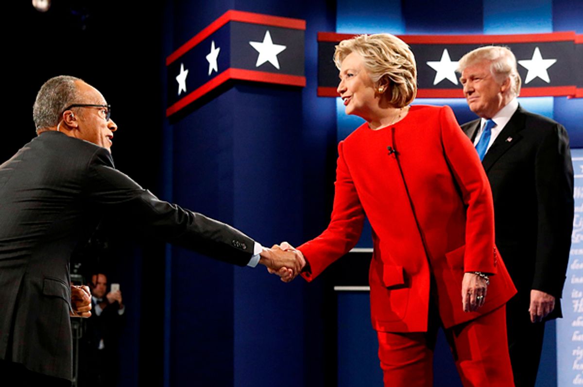 Hillary Clinton greets moderator Lester Holt of NBC News as she and Donald Trump take the stage for their first debate in Hempstead, New York, September 26, 2016.   (Reuters/Jonathan Ernst)