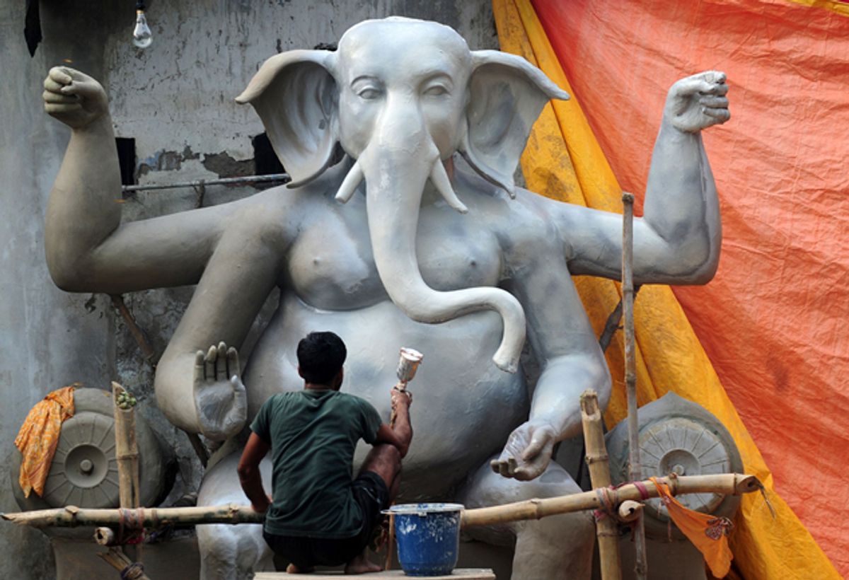 An Indian artisan puts the finishing touches of paint on an idol of elephant-headed Hindu God Ganesh ahead of the Ganesh Chaturthi festival in Allahabad on September 1, 2016. 
The popular eleven-day long Hindu religious festival, Ganesh Chaturthi will be celebrated from September 5-15. / AFP / SANJAY KANOJIA        (Photo credit should read SANJAY KANOJIA/AFP/Getty Images) (Afp/getty Images)