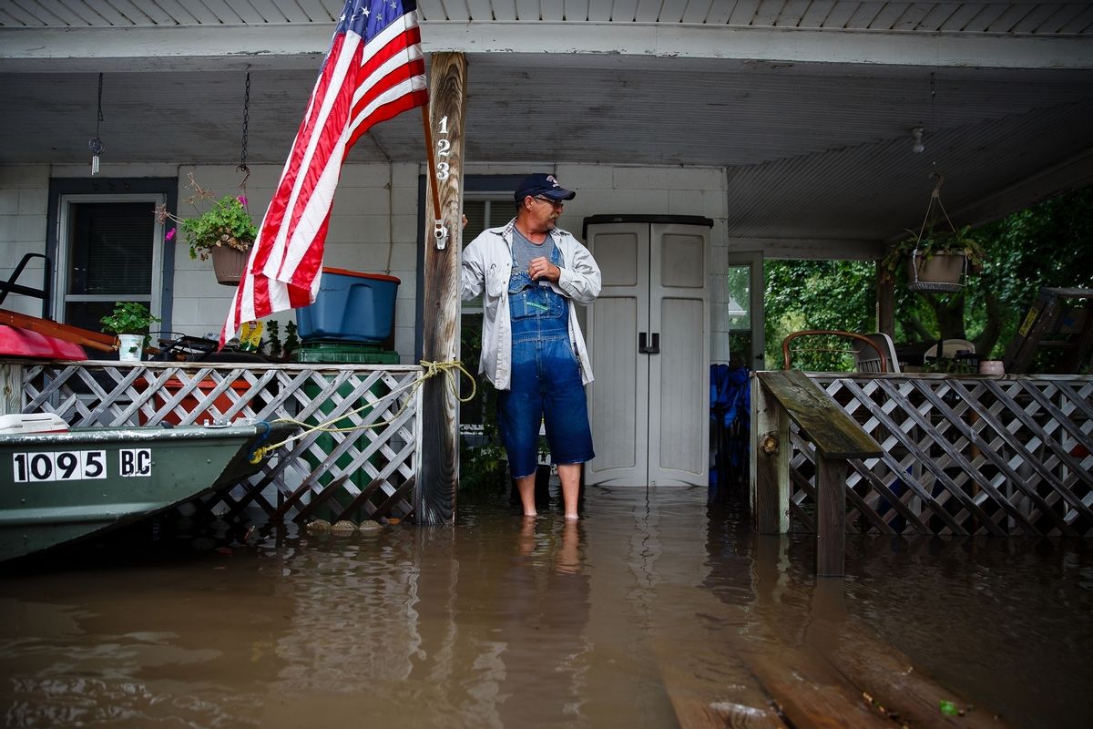Tom Moffitt stands on his deck as he looks at the flood waters on Friday, Sept. 23, 2016, in Shell Rock, Iowa. Authorities in several Iowa cities were mobilizing resources Friday to handle flooding from a rain-swollen river that has forced evacuations in several communities upstream, while a Wisconsin town was recovering from storms.   (Brian Powers/The Des Moines Register via AP  ) (AP)