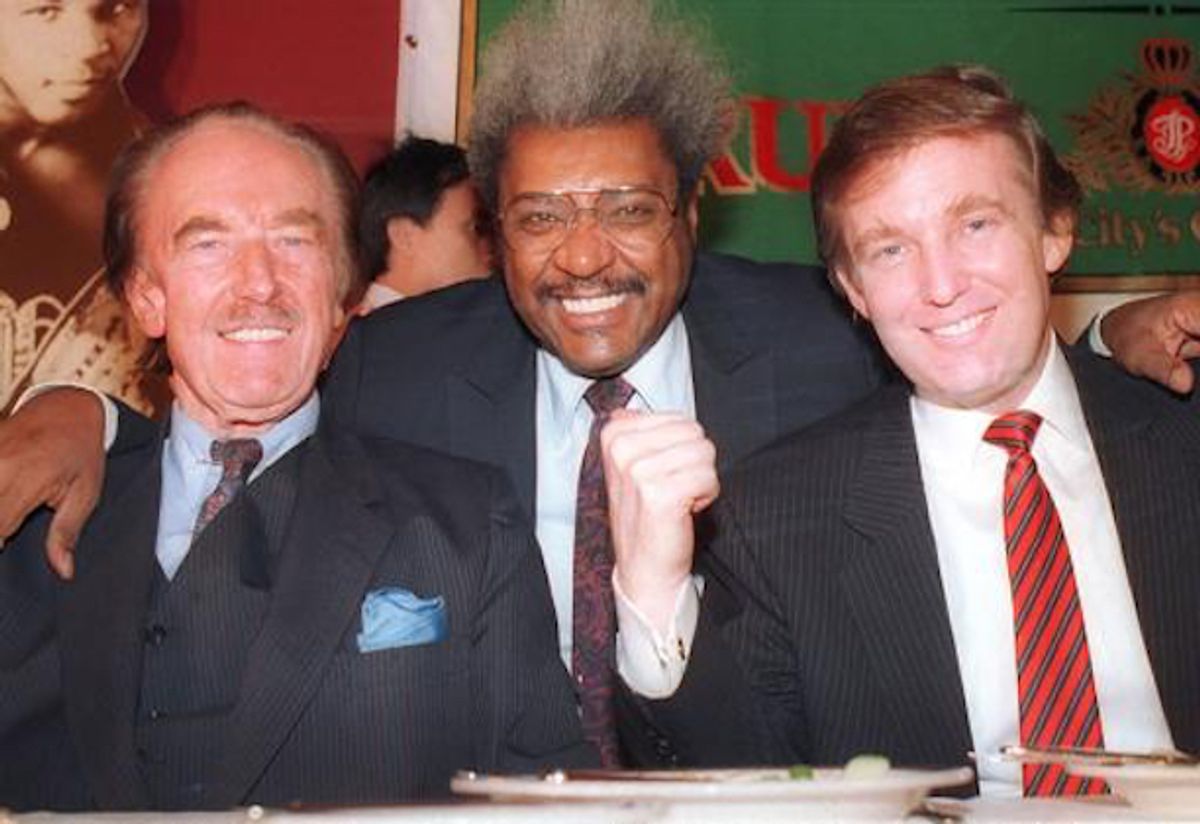 Donald Trump, right, pictured with his father, Fred Trump, far left, and boxing promoter Don King at a press conference in December 1987 in Atlantic City, NJ.  (AP Photo)