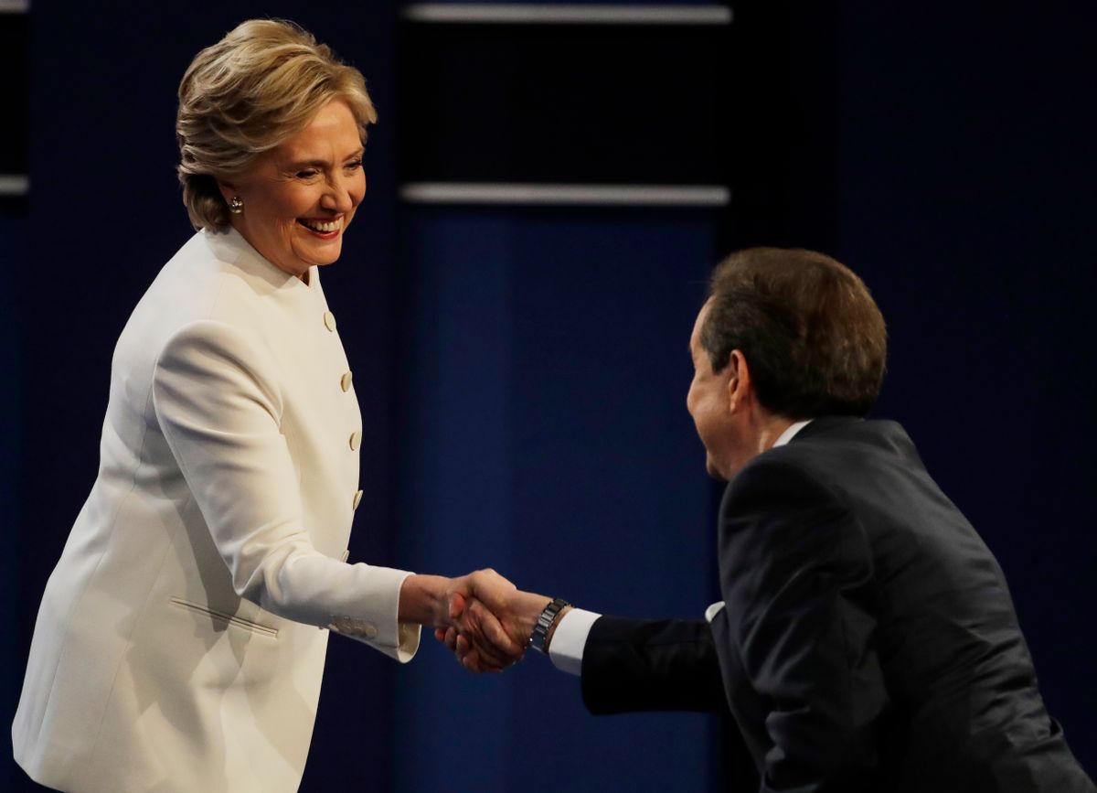 Democratic presidential nominee Hillary Clinton speaks shakes hands with moderator Chris Wallace following the third presidential debate with Republican presidential nominee Donald Trump at UNLV in Las Vegas, Wednesday, Oct. 19, 2016. (AP Photo/Patrick Semansky) (AP)