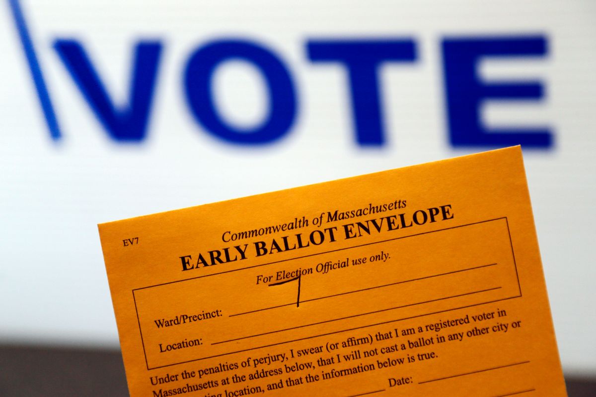 In this Oct. 24, 2016, photo, an early ballot envelope is held at town hall in North Andover, Mass. The millions of votes that have been cast already in the U.S. presidential election point to an advantage for Hillary Clinton in critical battleground states, as well as signs of strength in traditionally Republican territory. (AP Photo/Elise Amendola) (AP)