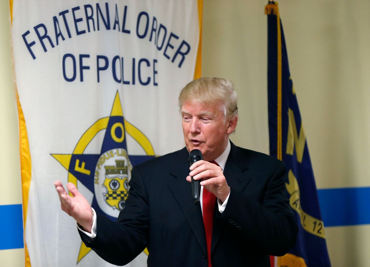 FILE - In this Aug. 18, 2016, file photo, Republican presidential candidate Donald Trump speaks to retired and active law enforcement personnel at a Fraternal Order of Police lodge during a campaign stop in Statesville, N.C. The endorsement by a national police organization for Trump has exposed a divide within the ranks of law enforcement: Can they support someone who calls himself the law-and-order candidate, but was caught on tape bragging about sexually predatory behavior toward women? And what about his antagonizing the very minority communities that police agencies need to win over amid turmoil over police shootings of unarmed black men? (AP Photo/Gerald Herbert, File) (AP)
