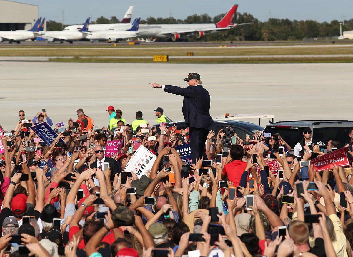 Donald Trump waves to cheering supporters at a Trump rally at Sanford Orlando International Airport in Sanford, Fla.,Tuesday, Oct. 25, 2016.  (AP)