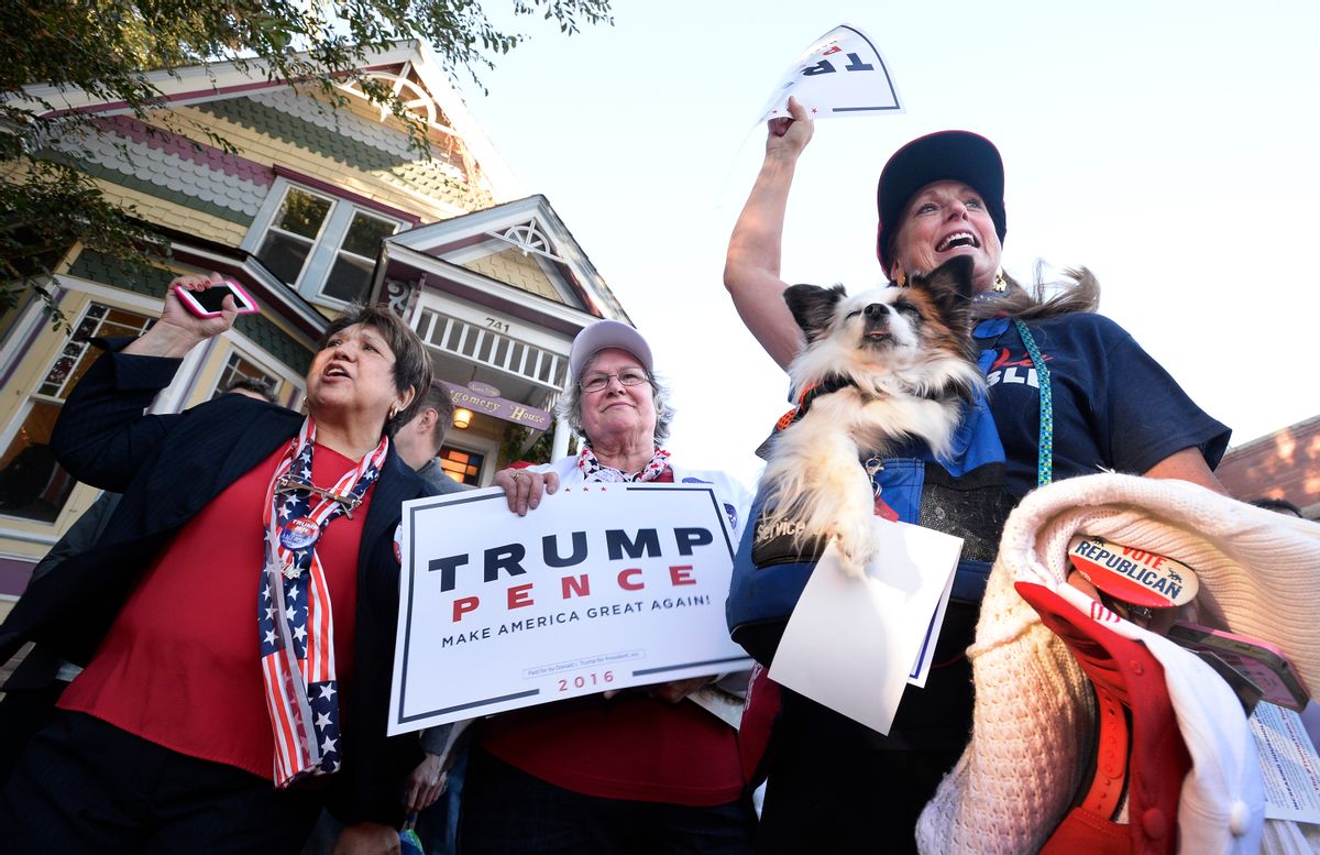 Republican presidential candidate Donald Trump supporters Mary Claire, from left, Colette McDonald and Karolee McLaughlin, with her dog Lakota, spar with protesters during an appearance by Donald Trump Jr., a son of presidential candidate Donald Trump, in Boulder, Colo., Monday, Oct. 17, 2016. (Paul Aiken/Daily Camera via AP) (AP)
