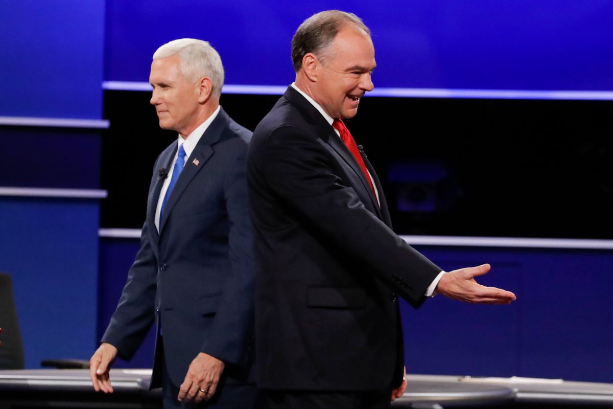 Republican vice-presidential nominee Gov. Mike Pence and Democratic vice-presidential nominee Sen. Tim Kaine, right, walk past each other after the vice-presidential debate at Longwood University in Farmville, Va., Tuesday, Oct. 4, 2016. (AP Photo/David Goldman) (AP)