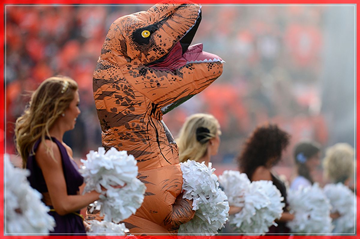 DENVER, CO - OCTOBER 30:  A Denver Broncos cheerleader in a dinosaur costume before the game against the San Diego Chargers at Sports Authority Field at Mile High on October 30, 2016 in Denver, Colorado. (Photo by Dustin Bradford/Getty Images) (Getty Images)