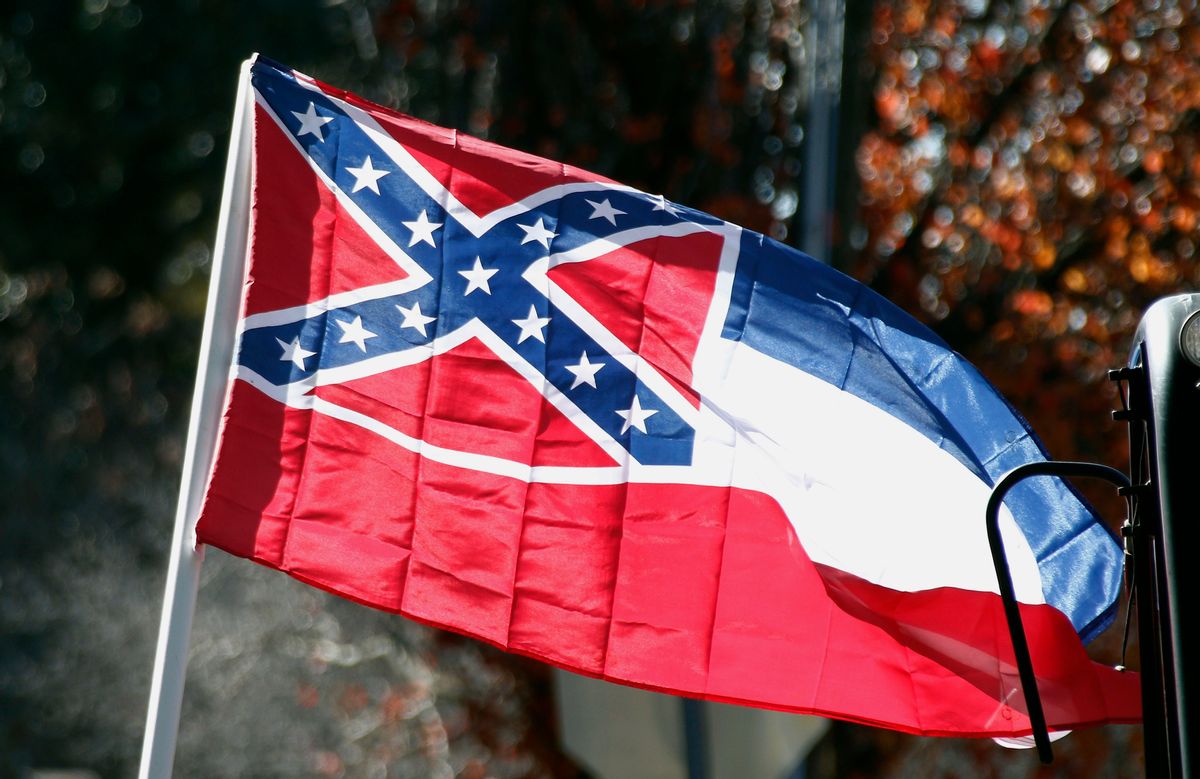 FILE - In this Tuesday, Jan. 19, 2016 file photo, a state flag of Mississippi is unfurled by Sons of Confederate Veterans and other groups on the grounds of the state Capitol in Jackson, Miss.An effort to erase the Confederate battle emblem from the Mississippi flag is failing because sponsors didn't gather enough signatures to put an initiative on the 2018 ballot. (AP Photo/Rogelio V. Solis, File) (AP)