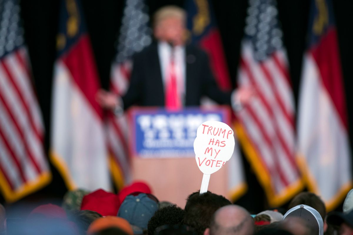 FILE - In this Monday, July 25, 2016 file photo, a supporter of Republican presidential candidate Donald Trump holds a sign during a campaign rally in Winston-Salem, N.C. A Kaiser Family Foundation-CNN poll released in September 2016 compared white college graduates and the white, black and Hispanic working class. Working-class whites were least likely to say that they're satisfied with their influence in the political process, that the federal government represents their views, and that they believe their children will achieve a better standard of living than themselves. (AP Photo/Evan Vucci) (AP)