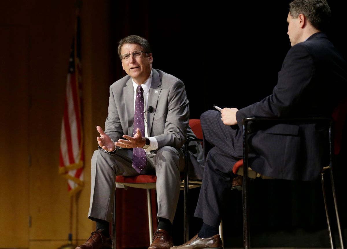 In this photo taken Wednesday, May 4, 2016 North Carolina Gov. Pat McCrory, left, make remarks concerning House Bill 2 while speaking during a government affairs conference in Raleigh, N.C. The North Carolina governor's race is everything voters anticipated it would be: expensive attack ads and barbed debates before what's essentially a referendum on the state's recent rightward tilt under Republican rule, particularly the state law limiting protections for LGBT people _ known as House Bill 2. (AP Photo/Gerry Broome, File) (AP)