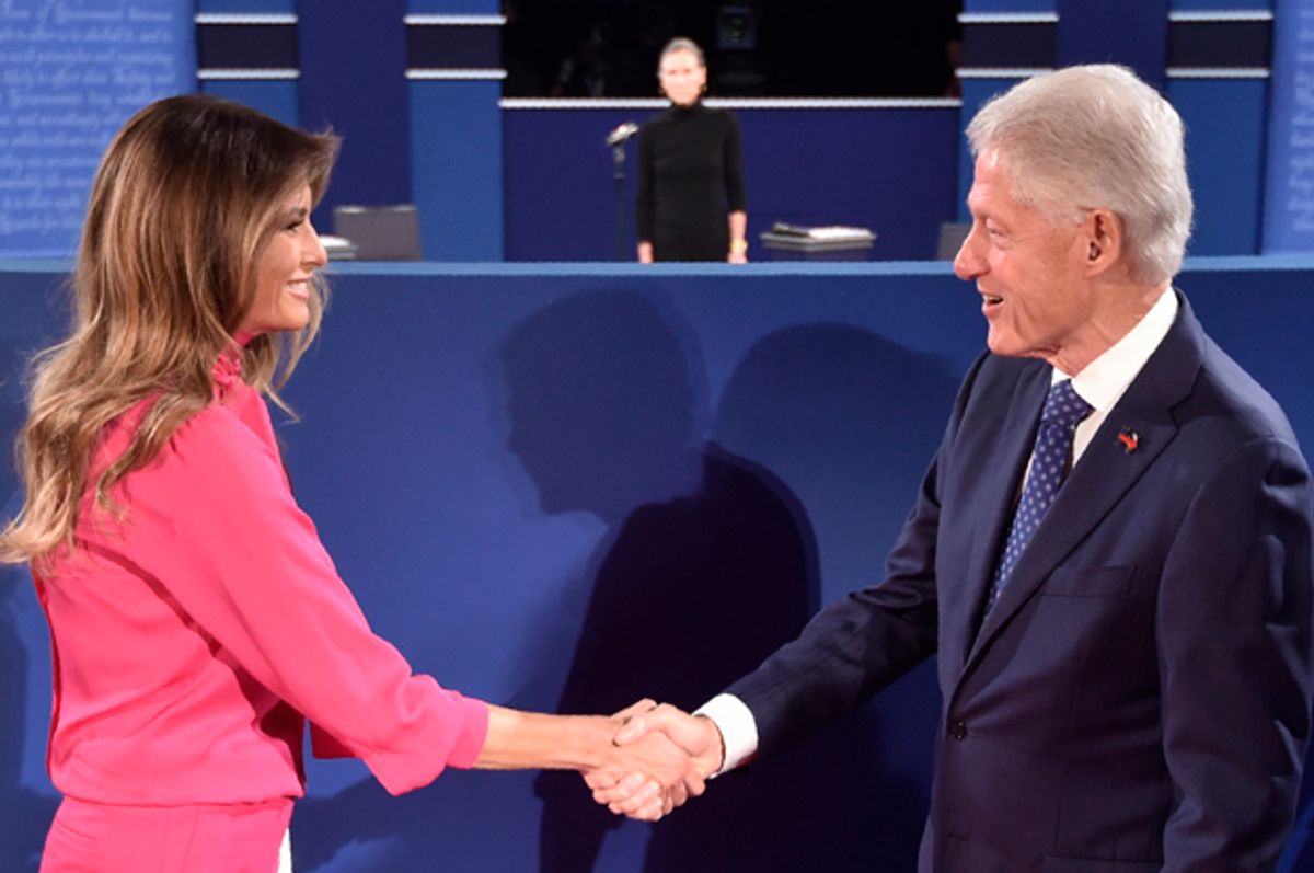 Bill Clinton greets Melania Trump before the start of the second presidential debate in St. Louis, Missouri on October 9, 2016.   (Getty/Paul J. Richards)