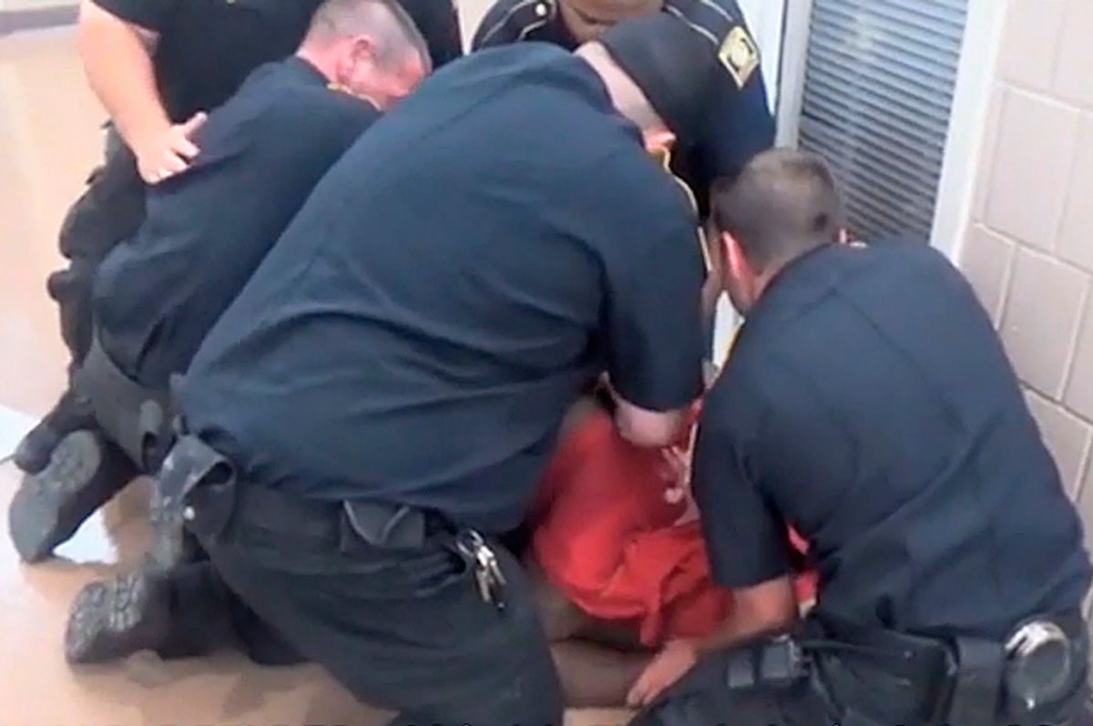 Michael Sabbie is restrained by guards, shortly before his death at Bi State Jail in Texarkana, Texas.  