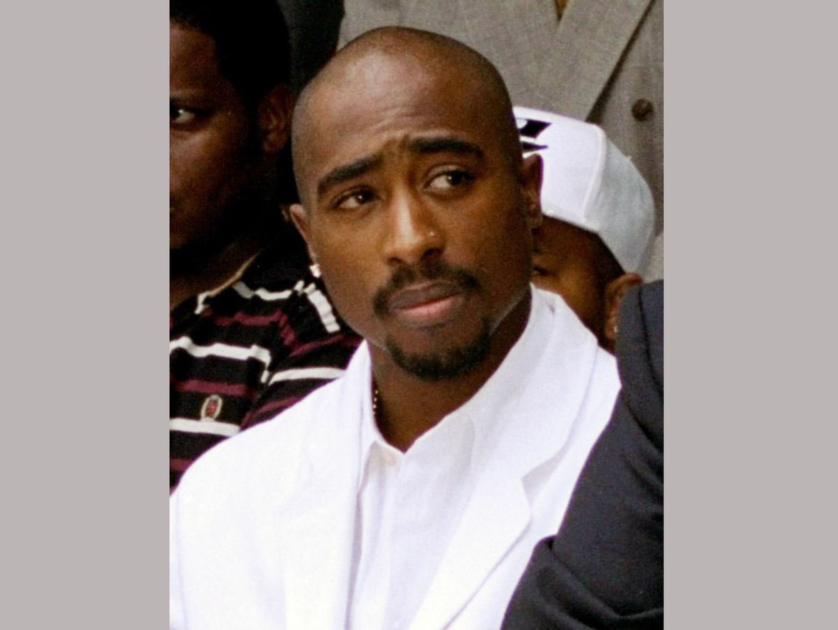FILE - In this Aug. 15, 1996, file photo, rapper Tupac Shakur attends a voter registration event in South Central Los Angeles. Shakur and Seattle-based rockers Pearl Jam are among the first-time nominees on the ballot for induction next year into the Rock and Roll Hall of Fame. (AP Photo/Frank Wiese, File) (AP)