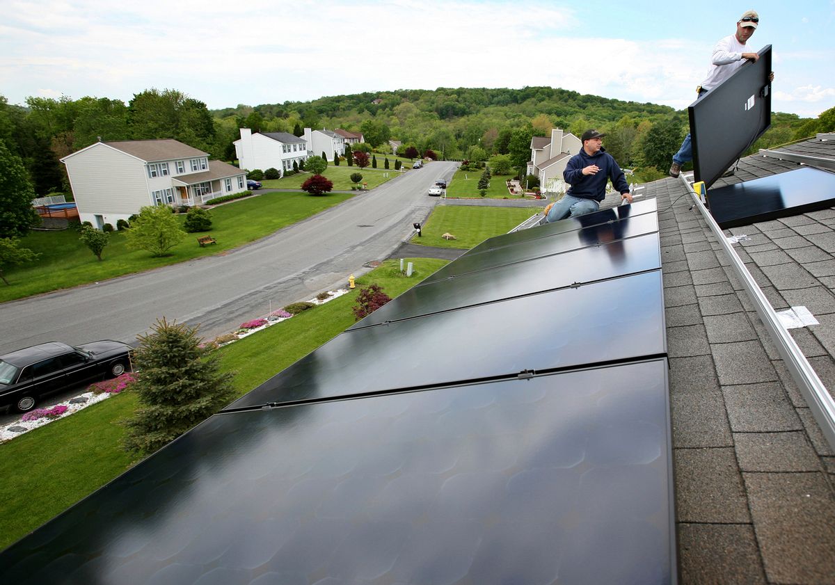 FILE - In this May 21, 2008, file photo, Marco DelTreste, left, and Arsenio Patricio, of Mercury Solar Systems, install panels on the roof of a home in Newburgh, N.Y. Energy-efficient upgrades can not only shrink your utility bill; they can increase the value of your home. The payoff time and the savings from installing solar panels will vary depending on where you live. (AP Photo/Craig Ruttle, File) (AP)