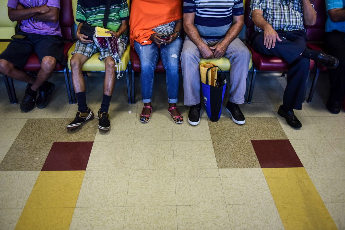 In this Oct. 24, 2016 photo, patients wait their turn at one of the Medical Center external clinics in San Juan, Puerto Rico. A steady departure of medical specialists from Puerto Rico has turned into a stampede amid the island's ongoing economic crisis leaving patients with few doctors to take care of their ills. () (AP Photo/Carlos Giusti)