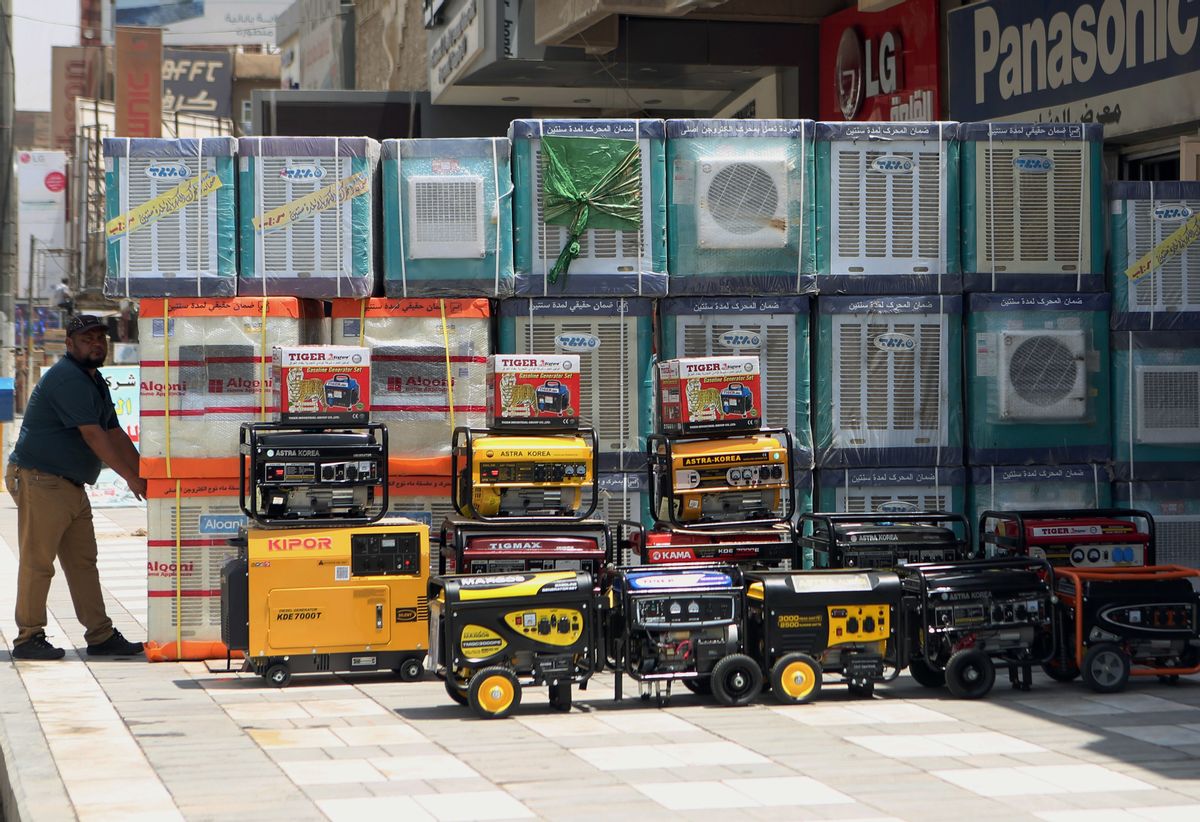 FILE - In this Thursday, July 30, 2015 file photo, air conditioners and power generators are displayed on a street in central Baghdad, Iraq. Nations reached a deal Saturday, Oct. 15, 2016 to limit the use of hydrofluorocarbons, or HFCs - greenhouse gases far more powerful than carbon dioxide that are used in air conditioners and refrigerators, in a major effort to fight climate change. (AP Photo/ Khalid Mohammed, File) (AP)
