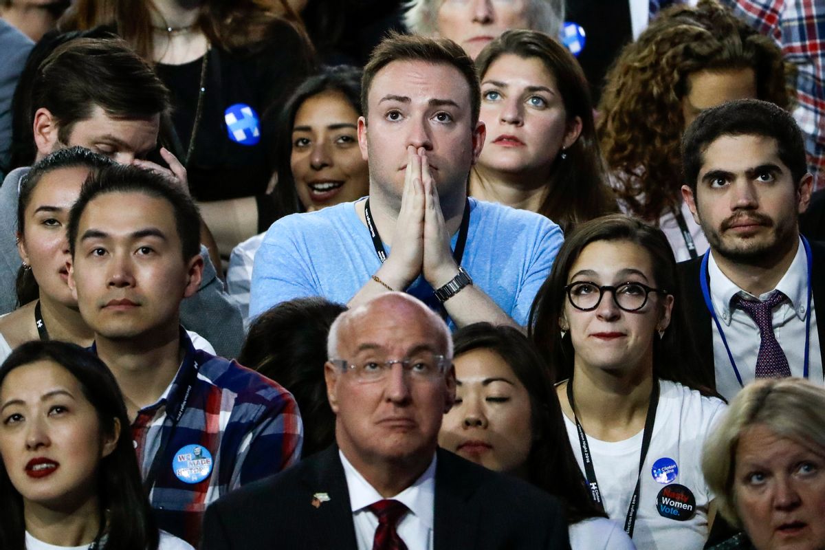 Guests at Democratic presidential nominee Hillary Clinton's election night rally watch the big screen television at the Jacob Javits Center glass enclosed lobby in New York. (AP)