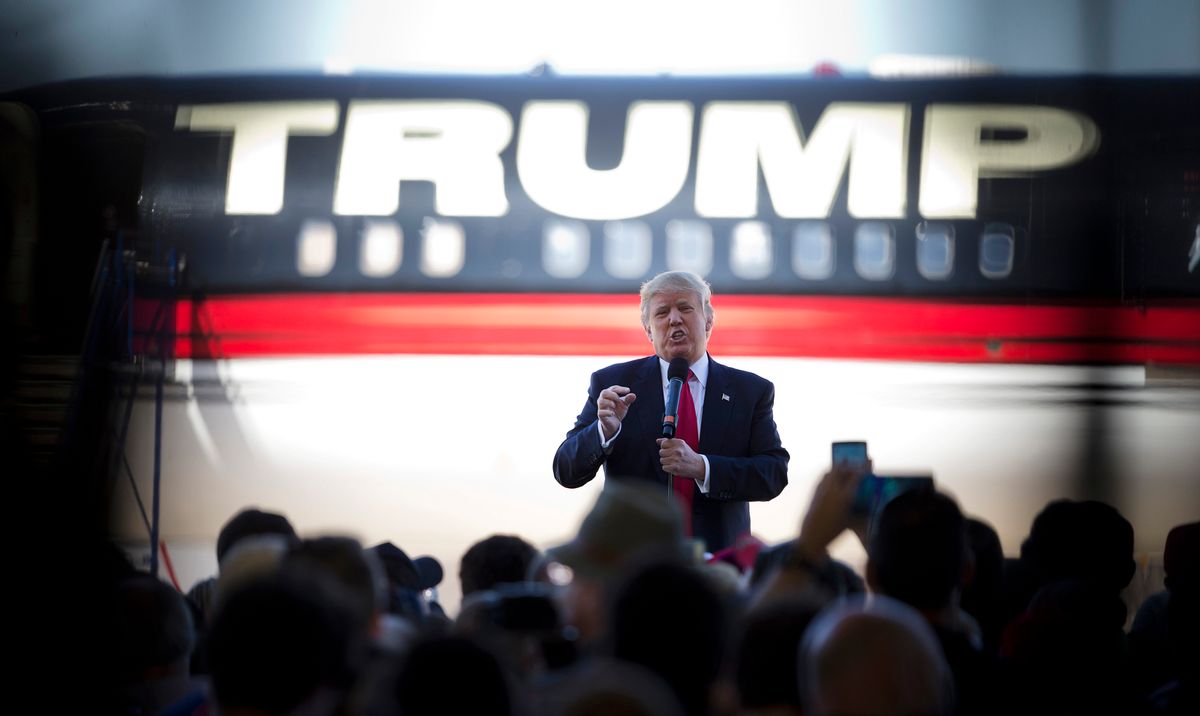 FILE - In this Saturday, Feb. 27, 2016 file photo, Republican presidential candidate Donald Trump stands in front of his airplane as he speaks during a rally in Bentonville, Ark. (AP Photo/John Bazemore) (AP)