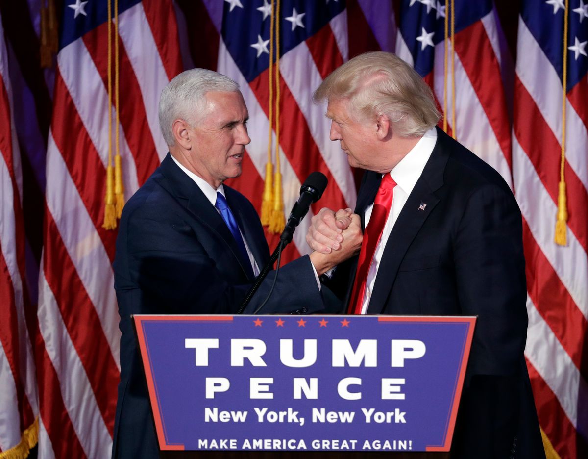 President-elect Donald Trump shakes hands with Vice President-elect Mike Pence as he gives his acceptance speech during his election night rally, Wednesday, Nov. 9, 2016, in New York. (AP Photo/John Locher) (AP)
