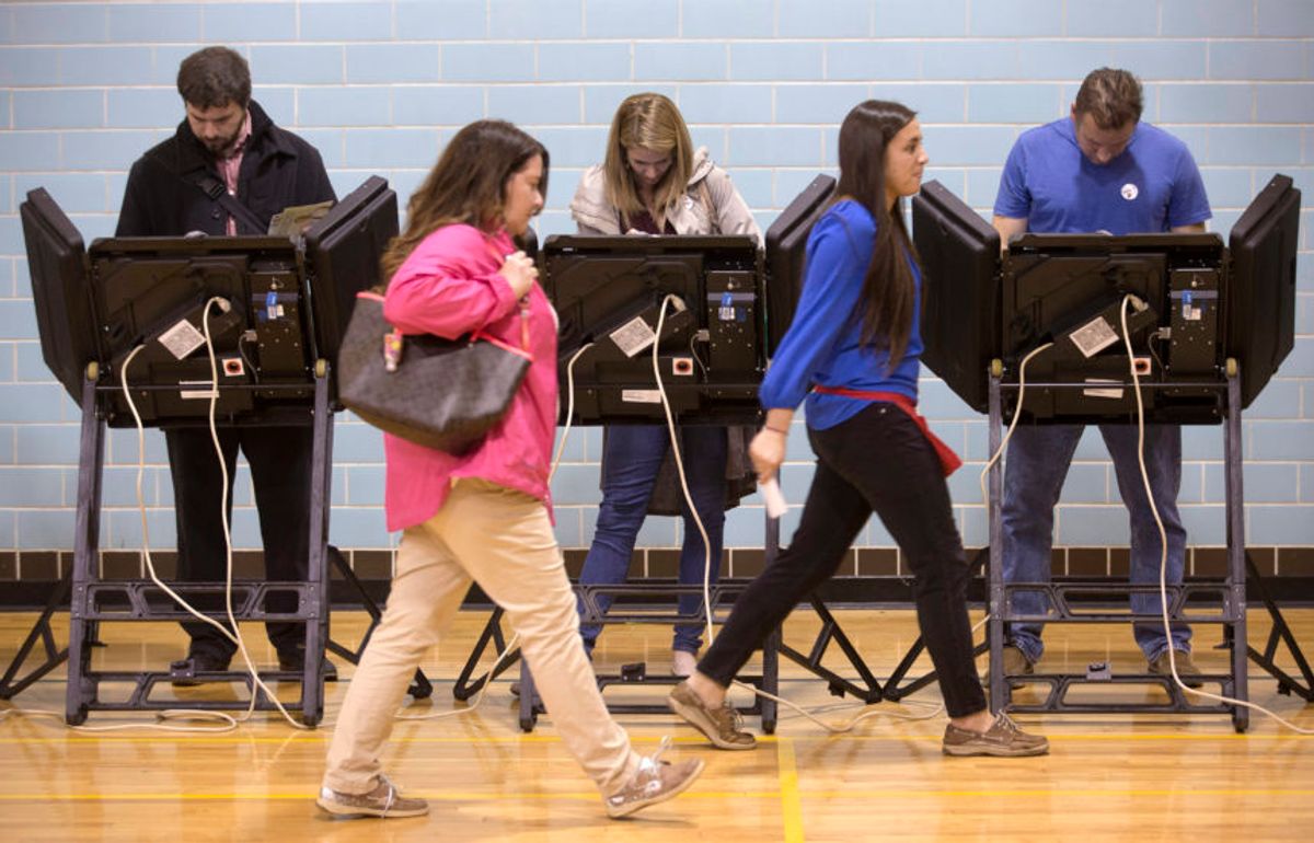 Voters in Ohio, 2015. (AP Photo/John Minchillo, File)