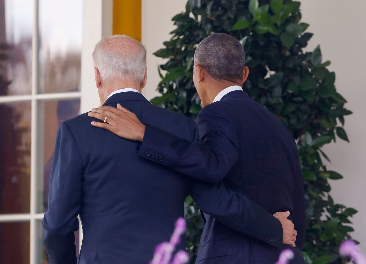 President Barack Obama and Vice President Joe Biden, with their arms on each other, walk back to the Oval Office of the White House in Washington, Wednesday, Nov. 9, 2016, after the president spoke about the election in the Rose Garden.  (AP)