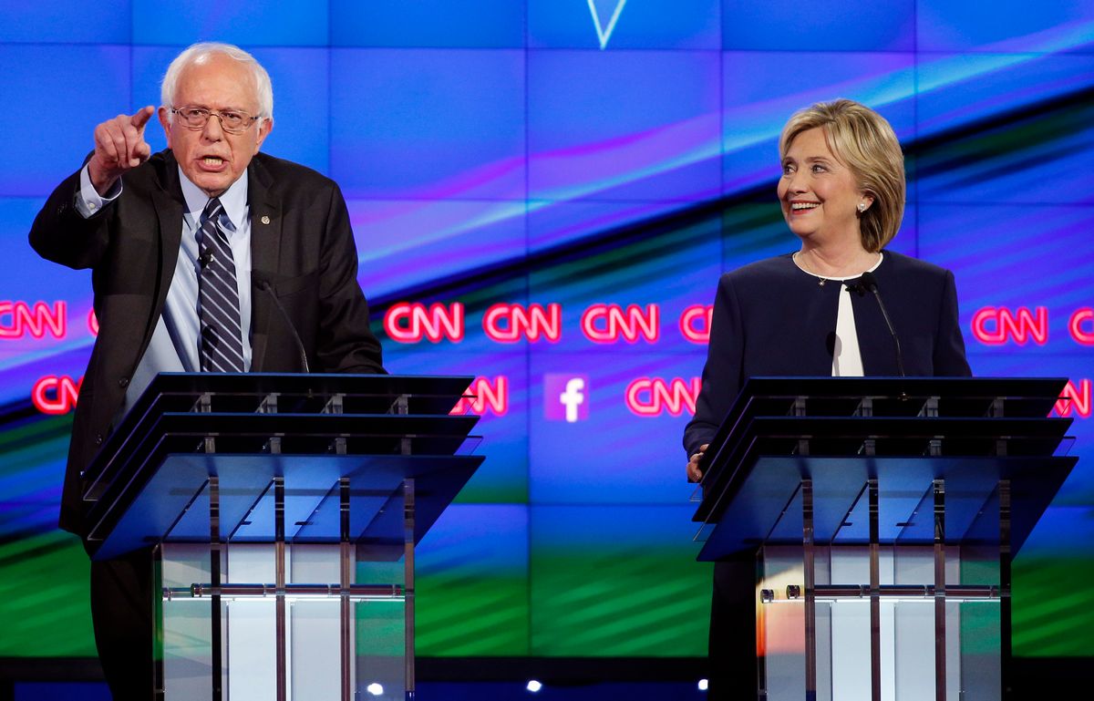 FILE - In this Tuesday, Oct. 13, 2015, file photo, Sen. Bernie Sanders, of Vermont, left, speaks as Hillary Clinton watches during a CNN Democratic presidential debate in Las Vegas. (AP Photo/John Locher, File) (AP)