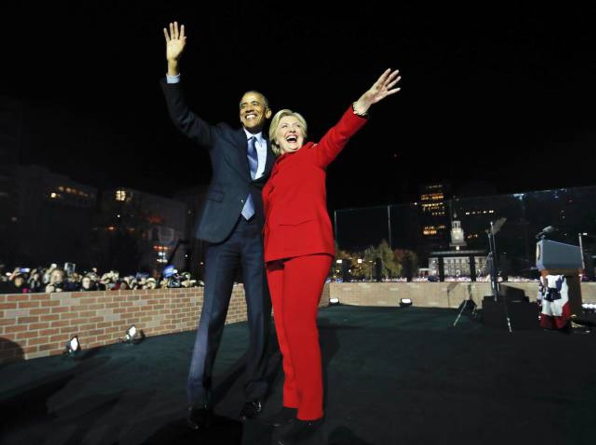 President Barack Obama waves on stage with Democratic presidential candidate Hillary Clinton during a rally at Independence Hall in Philadelphia. (AP)