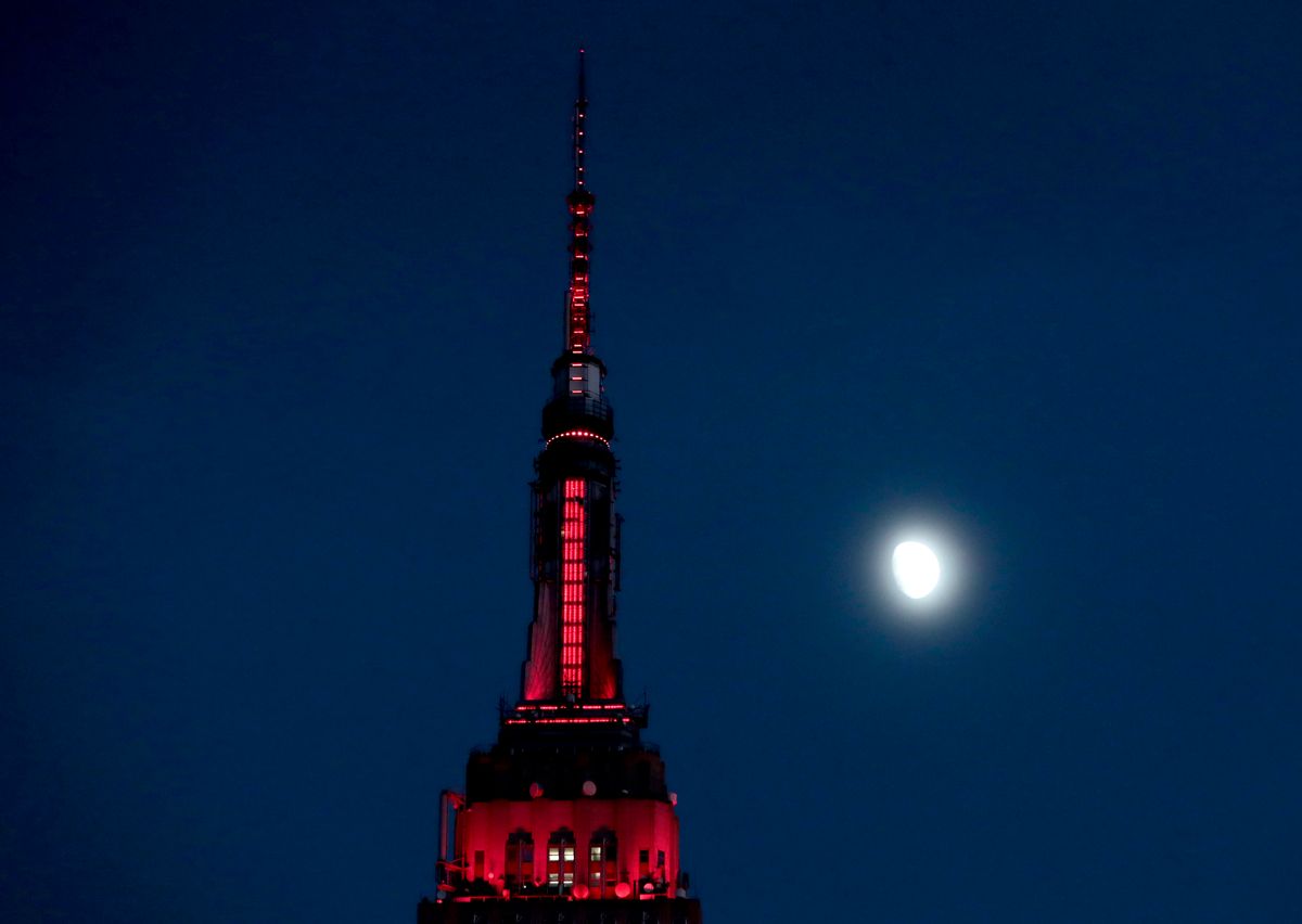 FILE - In this Thursday, Nov. 10, 2016, file photo, the moon is seen in its waxing gibbous stage as it rises near the Empire State Building, in New York. On Tuesday, Nov. 15, 2016, the Federal Reserve Bank of New York issues its Empire State manufacturing index for November. (AP Photo/Julio Cortez, File) (AP)