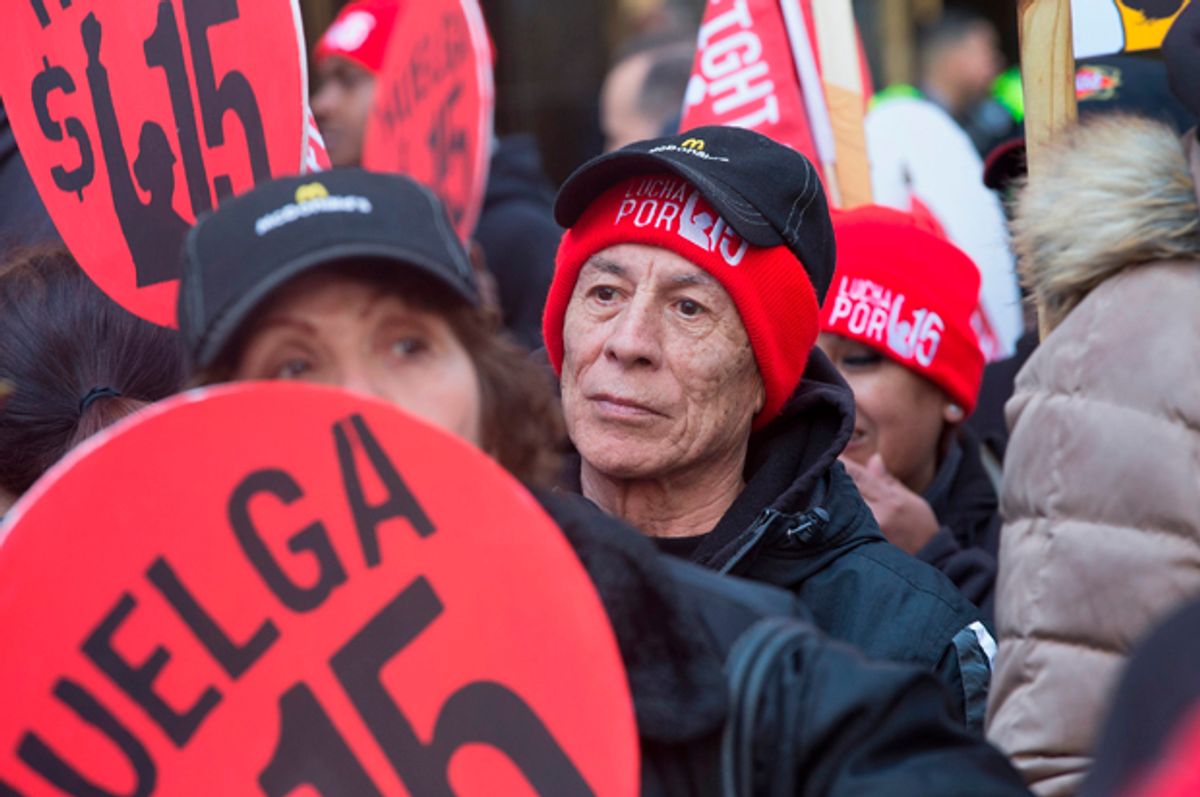 Demonstrators demanding an increase in the minimum wage to $15-dollars-per-hour prepare to march in the streets on April 14, 2016 in Chicago, Illinois   (Getty/Scott Olson)