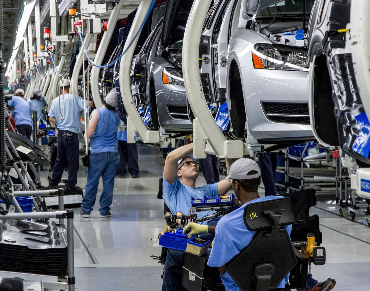 FILE - In this June 12, 2013, file photo, workers assemble Volkswagen Passat sedans at the German automaker's plant in Chattanooga, Tenn.  (AP Photo/Erik Schelzig, file) (AP)