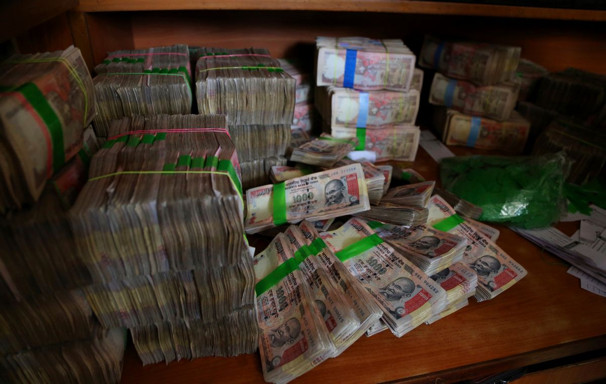 FILE - In this Nov. 10, 2016 file photo, discontinued Indian currency notes of 1,000 denomination are seen after they were deposited by people at a bank in Bangalore, India. Indian prime minister Narendra Modi, in his Nov. 8 televised address, announced the demonetization of India’s 500 and 1,000-rupee notes, which made up 86 percent of the country’s currency. There are doubts about whether the demonetization drive will truly make an impact on corruption and tax evasion. India’s underground economy is so big it accounts for up to a quarter of the country’s gross domestic product. And many of those possessing piles of black money have come up with ways to save much of it without drawing government attention. (AP)