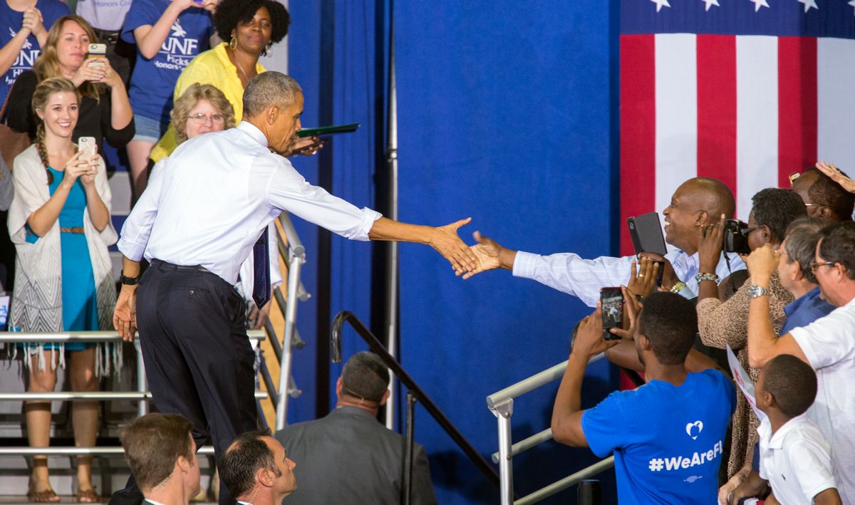 President Barack Obama shakes hand at a campaign rally for Democratic presidential candidate Hillary Clinton at the University of North Florida Arena in Jacksonville, Fla., Thursday, Nov. 3, 2016. (AP)