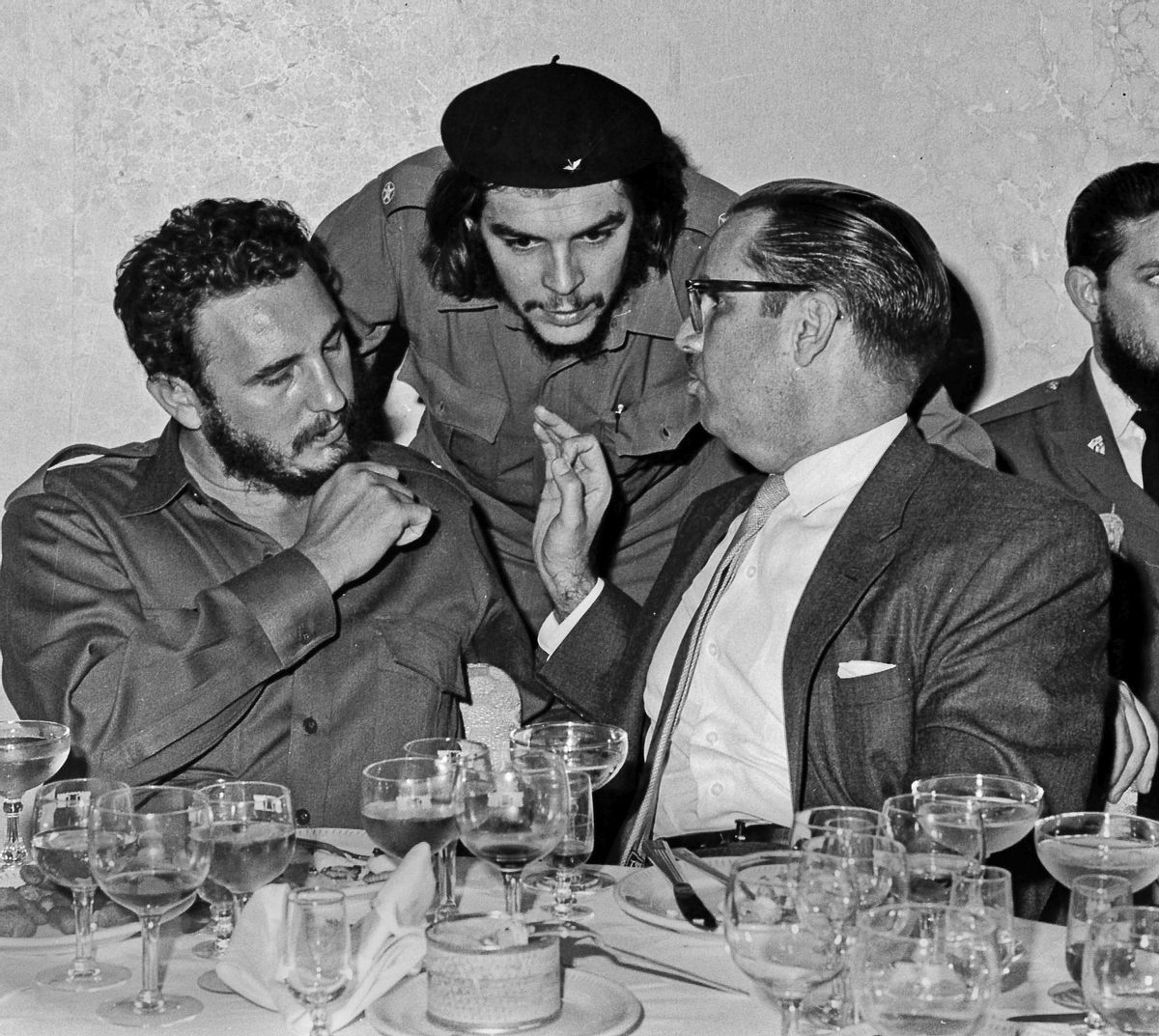 FILE - In this 1960 file photo, Cuba's revolutionary hero Ernesto "Che" Guevara, center, Cuba's leader Fidel Castro, left, and Cuba's President Osvaldo Dorticos, right, attend a reception in an unknown location in Cuba. Castro has died at age 90. President Raul Castro said on state television that his older brother died at 10:29 p.m. Friday, Nov. 25, 2016. (AP Photo/Prensa Latina via AP Images, File) (AP)