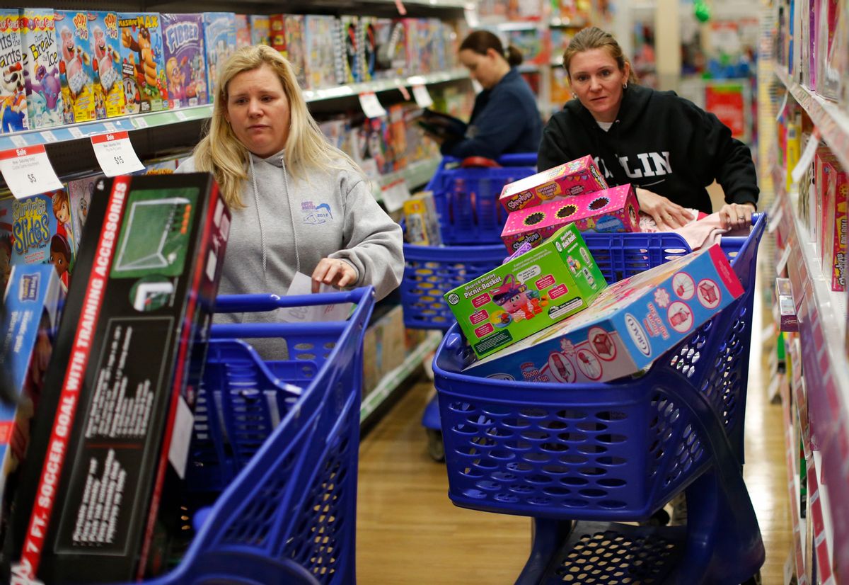 FILE - In this Friday, Nov. 27, 2015, file photo, cousins Stacy Levine, left, and Melissa Bragg shop at a Toys R Us store in Atlanta on Black Friday.  ((Bob Andres/Atlanta Journal-Constitution via AP, File))