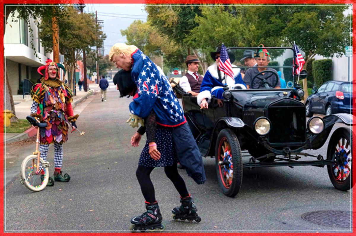 A roller skater carrying an effigy of President elect Donald Trump draped in an American flag rides down the street prior to participating in the 39th Occasional Pasadena Doo Dah Parade on Sunday, Nov. 20, 2016 in Pasadena, Calif.  (AP Photo/Richard Vogel) (AP)
