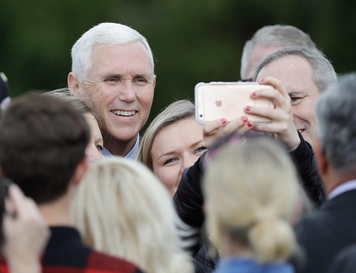 Vice President-elect Mike Pence poses for photos after speaking at a Veterans Day ceremony at Camp Atterbury in Edinburgh, Ind., Friday, Nov. 11, 2016. (AP Photo/Darron Cummings) (AP)