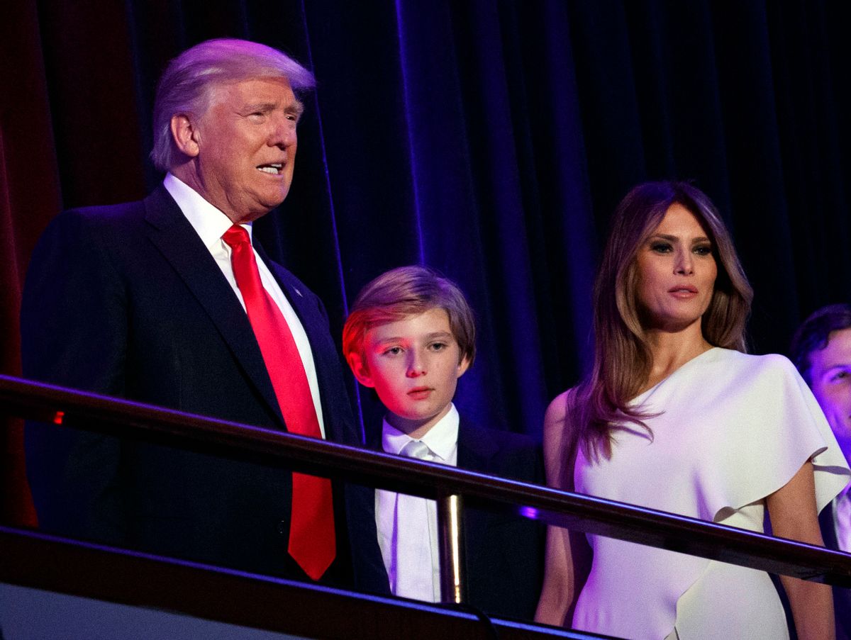 FILE - In this Nov. 9, 2016, file photo, President-elect Donald Trump, left, arrives to speak at an election night rally with his son Barron and wife Melania, in New York. Breaking with tradition, Donald Trump will move into the White House after the inauguration while wife Melania and 10-year-old son Barron plan to remain in New York City until at least the end of the school year. (AP Photo/Evan Vucci, File) (AP)