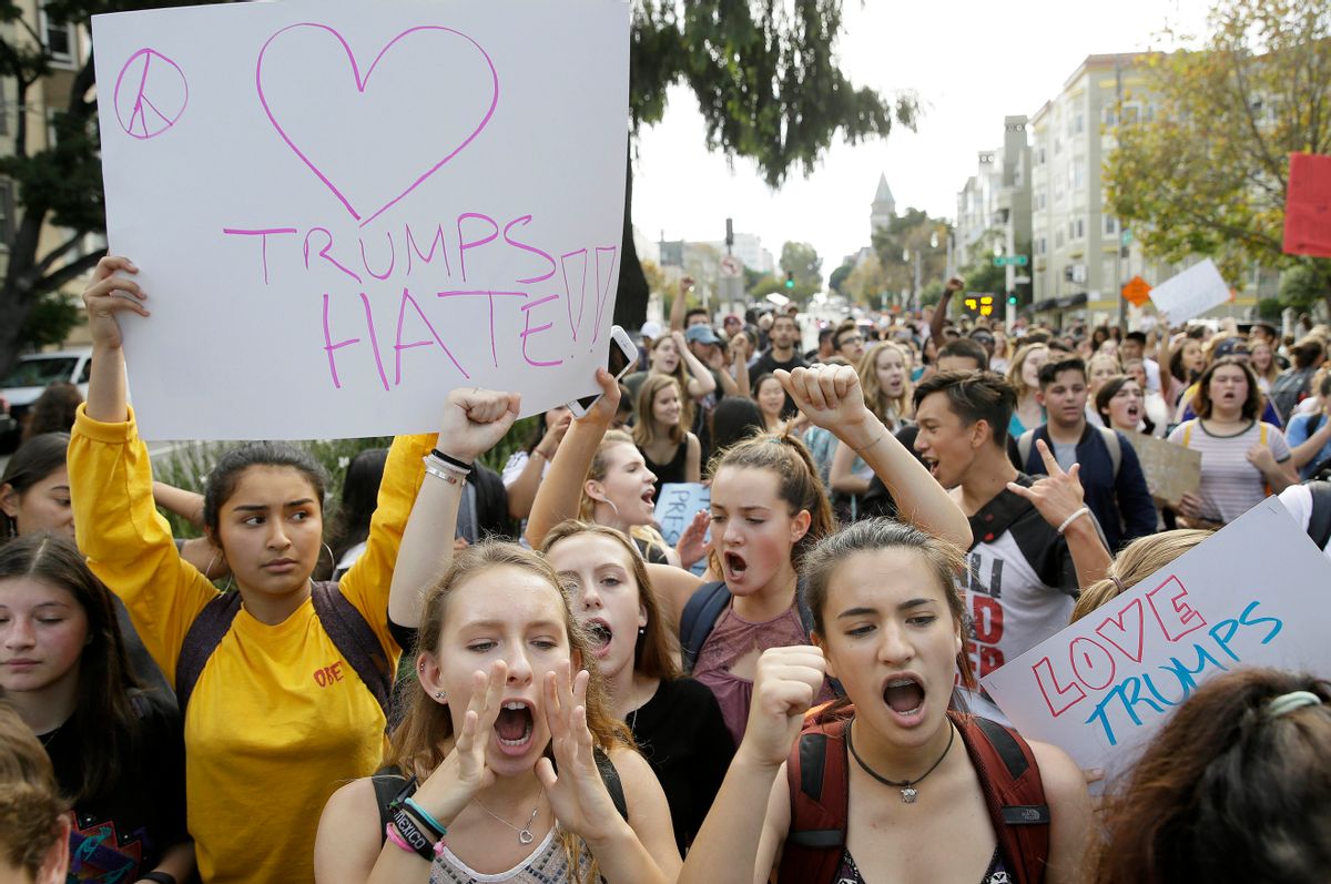 FILE - In this Thursday, Nov. 10, 2016, file photo, high school students protest in opposition of Donald Trump's presidential election victory in San Francisco. Thousands of high school students have taken to the streets in cities across the country since Donald Trump's election to protest his proposed crackdown on illegal immigration and his vulgar comments about women. It's an unusual show of political involvement on the part of young people who can't even vote yet. And experts say it can lead to increased activism when they are adults. (AP Photo/Eric Risberg, File) (AP)
