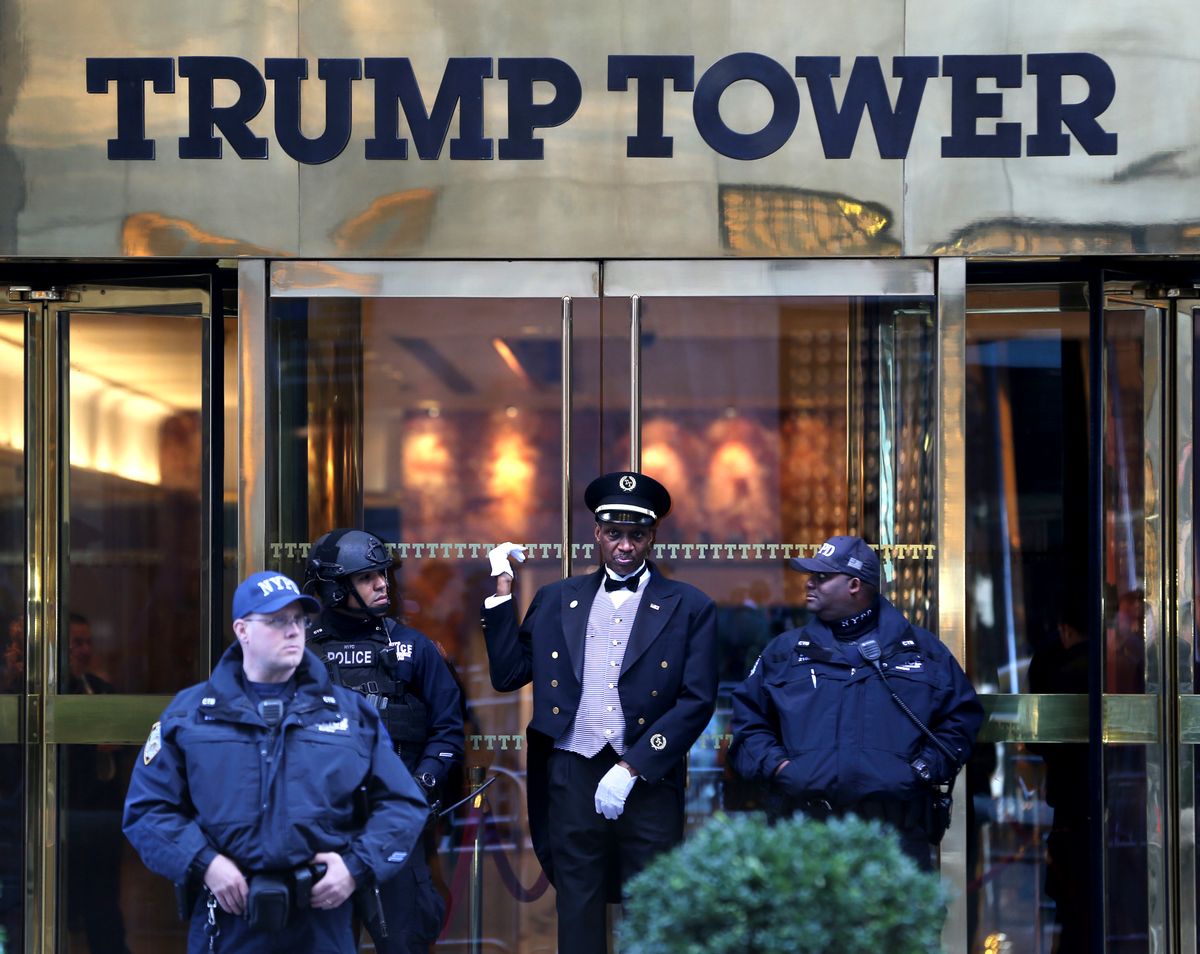 A doorman, center, talks with security personnel at the front entrance of Trump Tower in New York, Thursday, Nov. 17, 2016.  (AP)