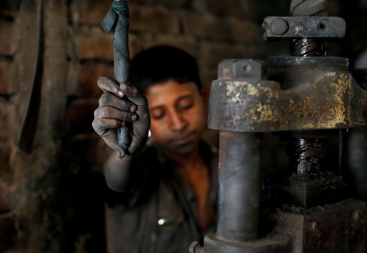 FILE- In this Sunday, June 12, 2016, photo, Abdullah, 12, works at a metal factory in Dhaka, Bangladesh. A new study by the London-based Overseas Development Institute found that thousands of Bangladeshi children who live in the capital's slums are working illegally for an average of 64 hours a week. (AP Photo/A.M. Ahad, File) (AP)