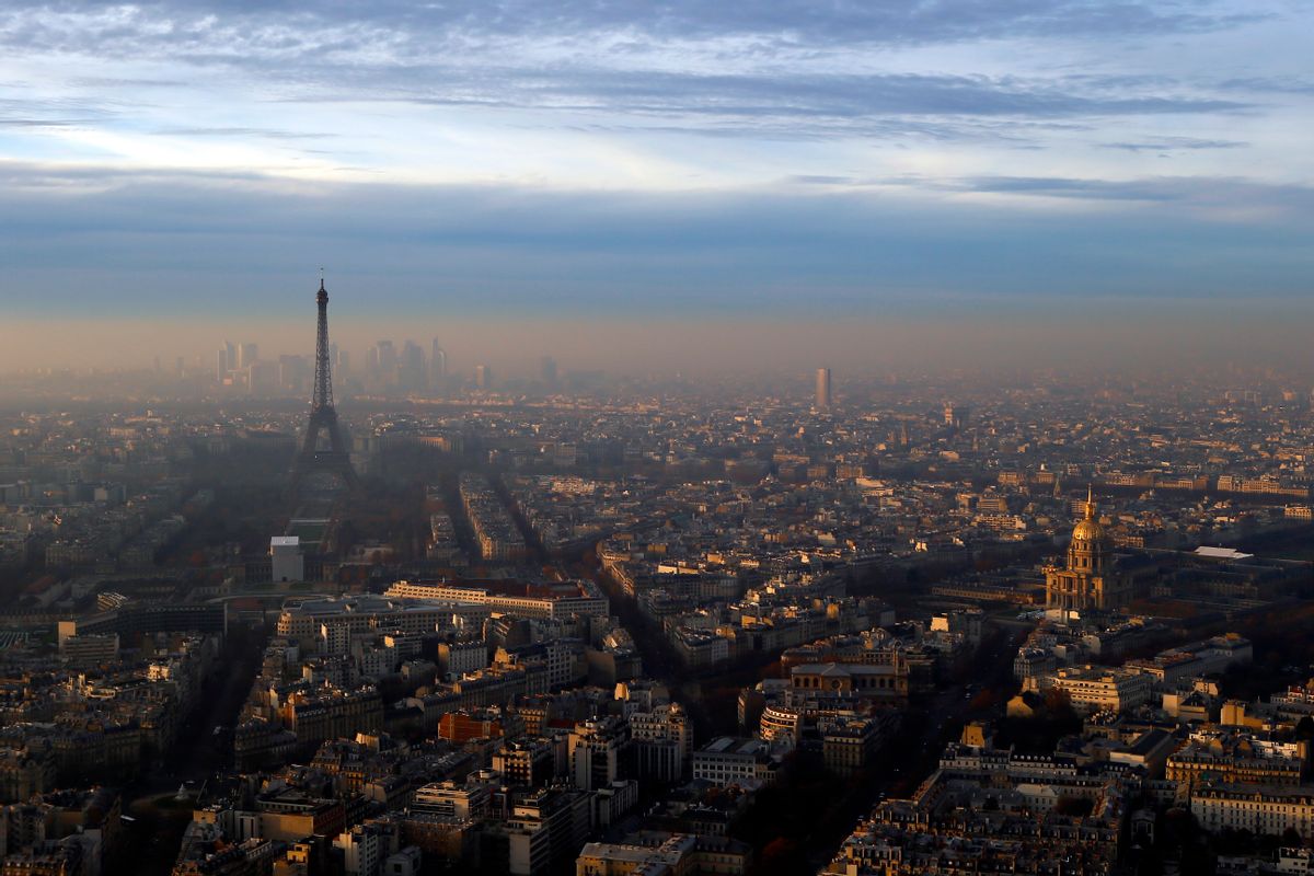 The Eiffel Tower and The Invalides dome, right, are seen from the Montparnasse Tower, as Paris suffers a pollution spike, Wednesday, Dec. 7, 2016. Paris' Police authority is again cracking down on the city's rocketing air pollution with a 24-hour traffic-regulating scheme that aims to halve the day's emissions from road vehicles. () (AP Photo/Francois Mori)