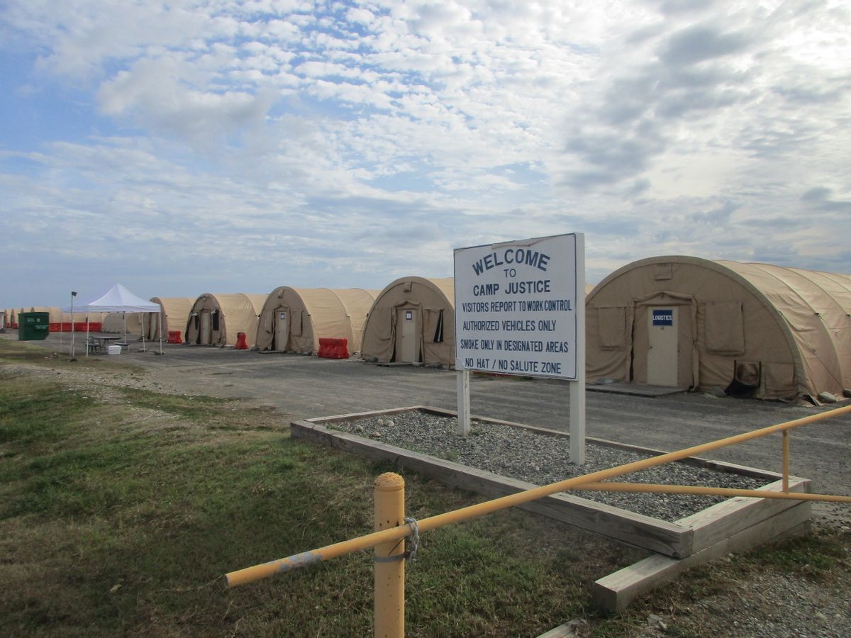 This Dec. 10, 2016 photo, shows the exterior of Camp 6 at the detention center at the U.S. Navy base at Guantanamo Bay, Cuba, where the U.S. holds 59 prisoners, including 22 cleared for release. The military has consolidated all remaining prisoners in Camp 6 and Camp 7, leaving other parts of the detention center vacant. (A) (AP Photo/Ben Fox)