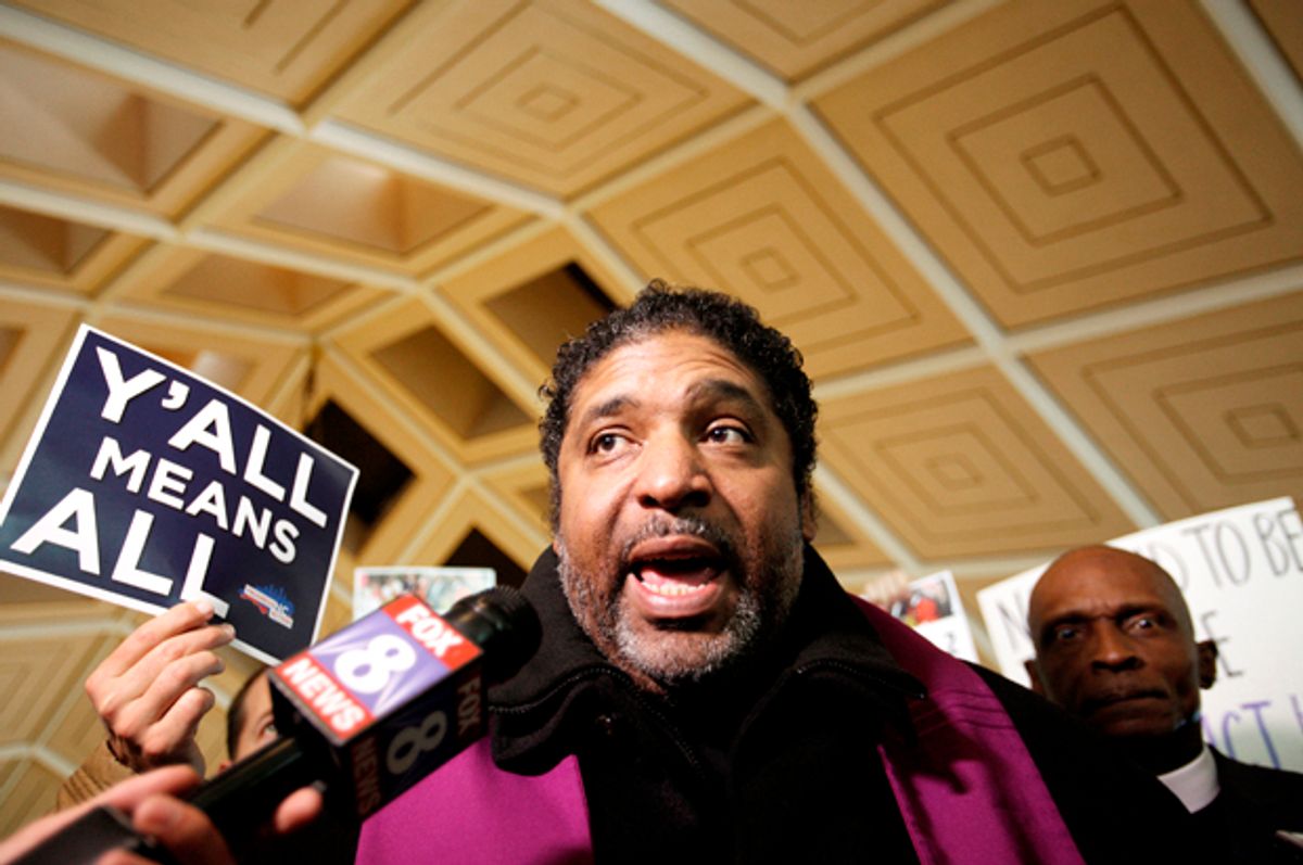 Civil rights leader Reverend William Barber, president of the NAACP in North Carolina, speaks to the media inside the state's Legislative Building (Reuters/Jonathan Drake)