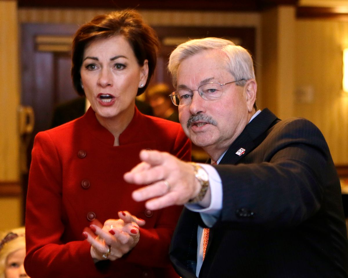 FILE - In this Nov. 4, 2014, file photo, Iowa Gov. Terry Branstad and Lt. Gov. Kim Reynolds, left, watch early election returns in West Des Moines, Iowa. An aide to President-elect Donald Trump confirmed Wednesday, Dec. 7, 2016, that Trump has offered to nominate Branstad as U.S. ambassador to China. The likely departure of the nation's longest-serving governor to accept the appointment means Iowa could be led by its first female governor. (AP Photo/Charlie Neibergall, File) (AP)