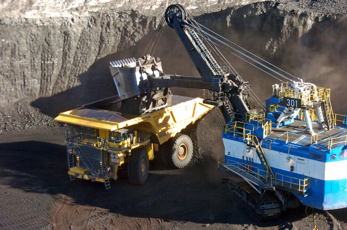 FILE - In this Nov. 15, 2016 file photo, a mechanized shovel loads coal from an 80-feet thick seam into a haul truck at Cloud Peak Energy's Spring Creek mine near Decker, Mont.  (AP Photo/Matthew Brown, File) (AP)