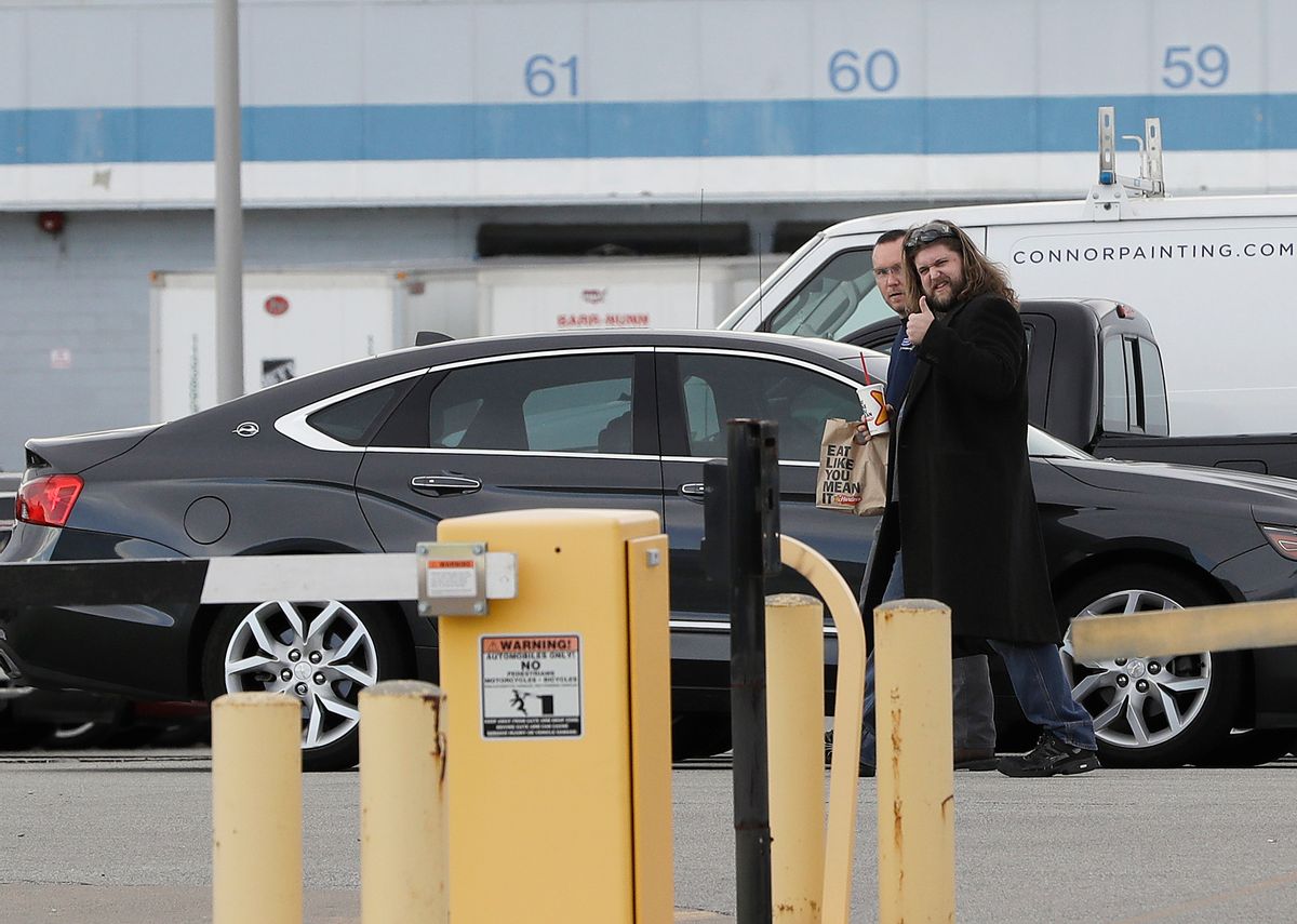 Employees walk in the Carrier Corp. plant parking lot, Wednesday, Nov. 30, 2016, in Indianapolis. Carrier and President-elect Donald Trump reached an agreement to keep nearly 1,000 jobs in Indiana. Trump and Vice President-elect Mike Pence planned to travel to the state Thursday to unveil the agreement alongside company officials. (AP Photo/Darron Cummings) (AP)